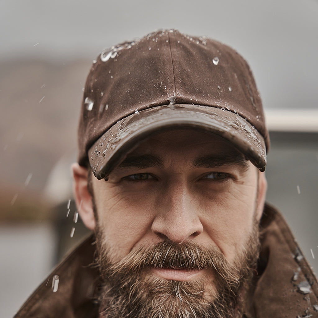 Lifestyle image of Hoggs of Fife Waxed Baseball Cap - Wild & Moor