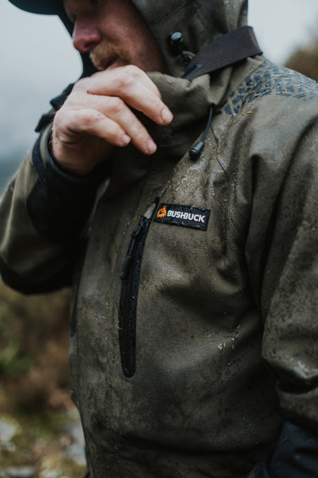 Man wearing the Bushbuck Defender jacket in the rain