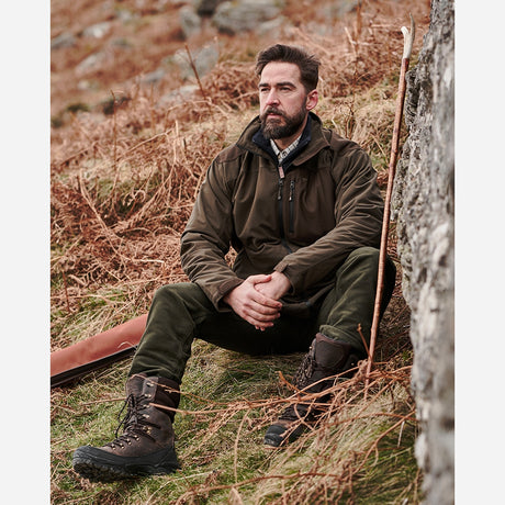 Lifestyle Image of Hoggs of Fife Kinross II Waterproof Field Jacket Green/Brown - Wild & Moor
